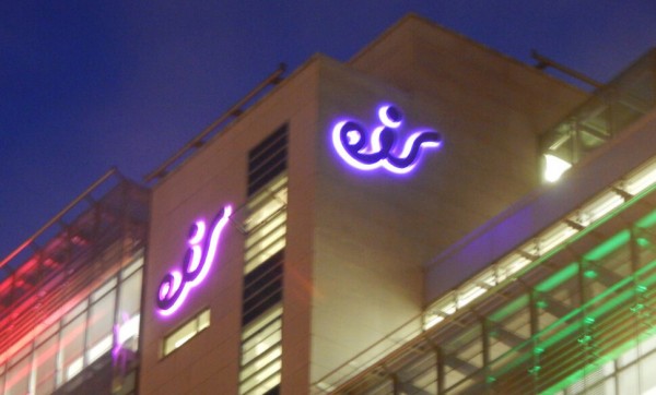 Lit up built up LED sign at night displayed at eir HQ