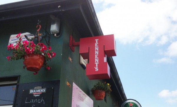 A projecting sign with LED lighting displayed outside of a pub in ireland