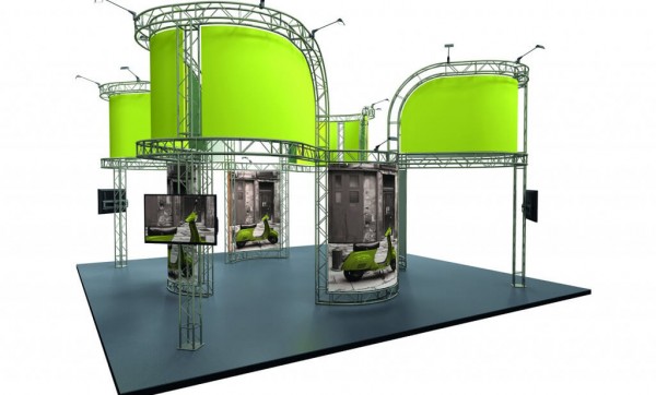 Modular exhibitions display with no walls featuring large curved fabric graphic overhead and rectangular fabric displaying scooters