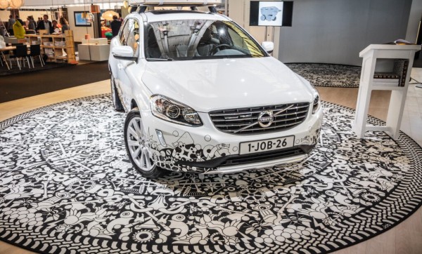 An exhibitions display from volvo with a print design carpet that is also featured on a volvo car
