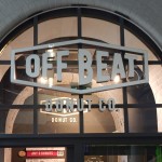 Image depicting the exterior signage of Offbeat Donuts that open into Pearse Street Dart station