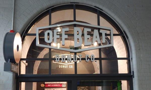 Image depicting the exterior signage of Offbeat Donuts that open into Pearse Street Dart station