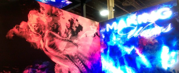 fabric graphics stand at globalshop with two lightboxes, one which flashed illuminous light and the other gradually changed from red to blue