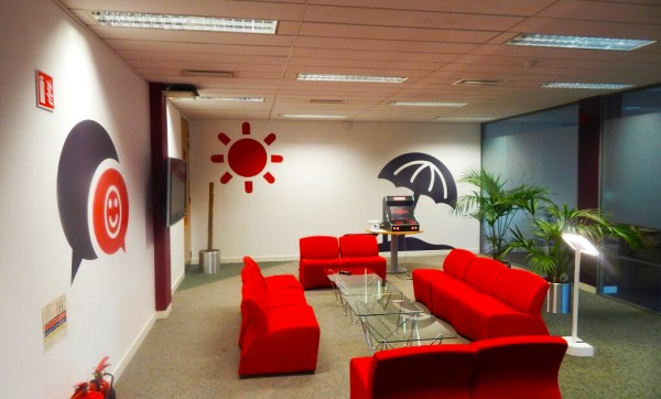 wall graphic at Virgin Media offices printed with sun and umbrella icons