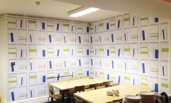 wall graphic in a restaurant depicting a large bookshelf