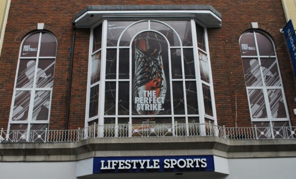 Window graphic at lifestyle sports depicting a Nike football boot